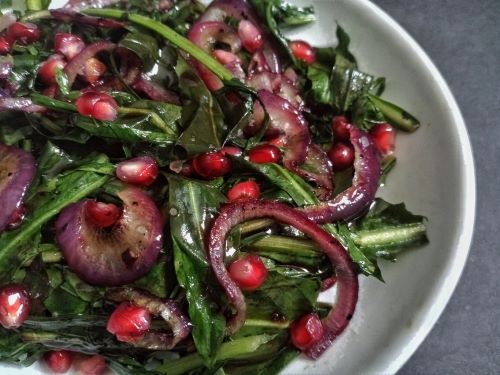 Warm Dandelion Greens with Pomegranate and Onions